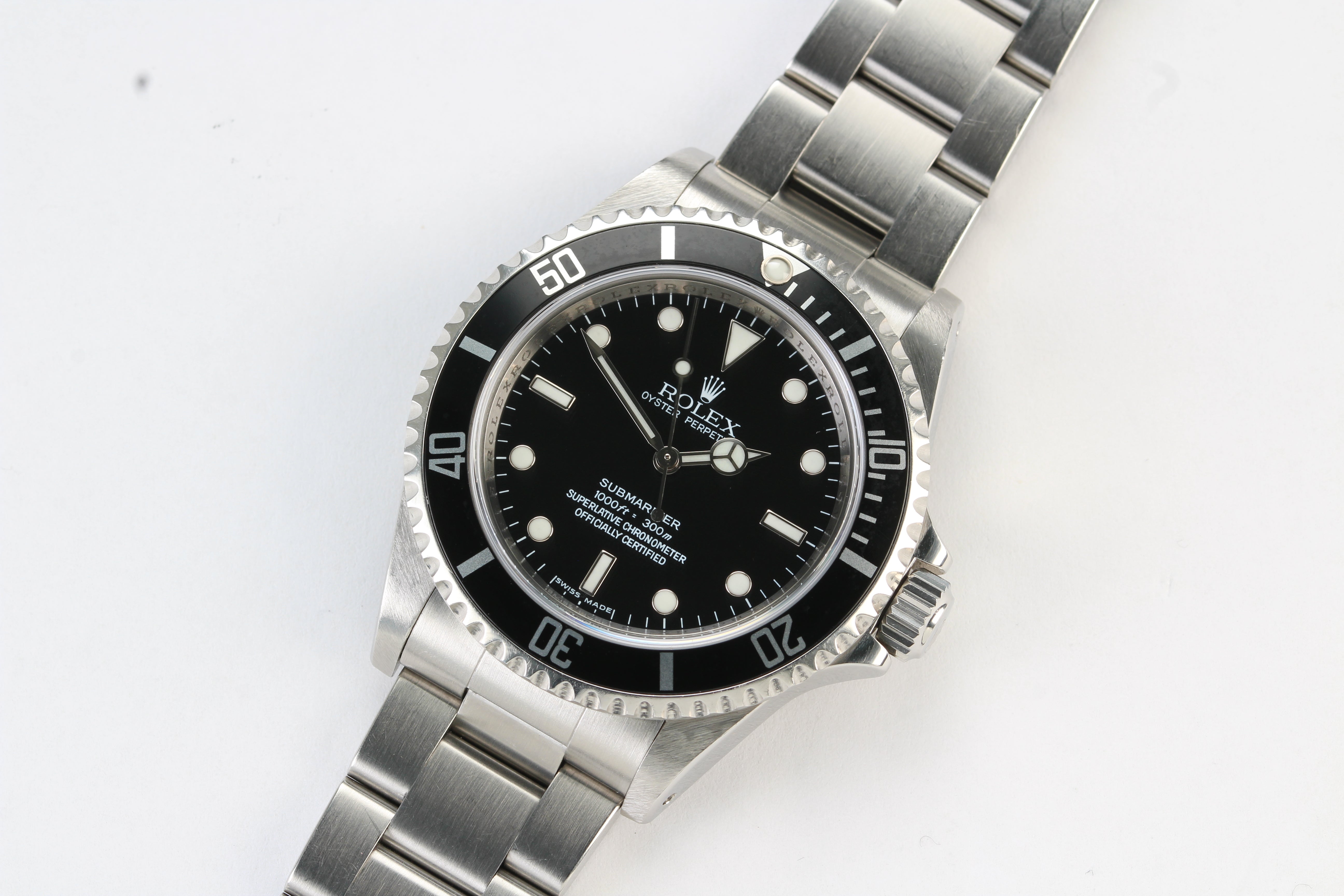 Rolex Submariner 14060M “Four Lines” on Oyster Bracelet with Warranty Card and Booklets