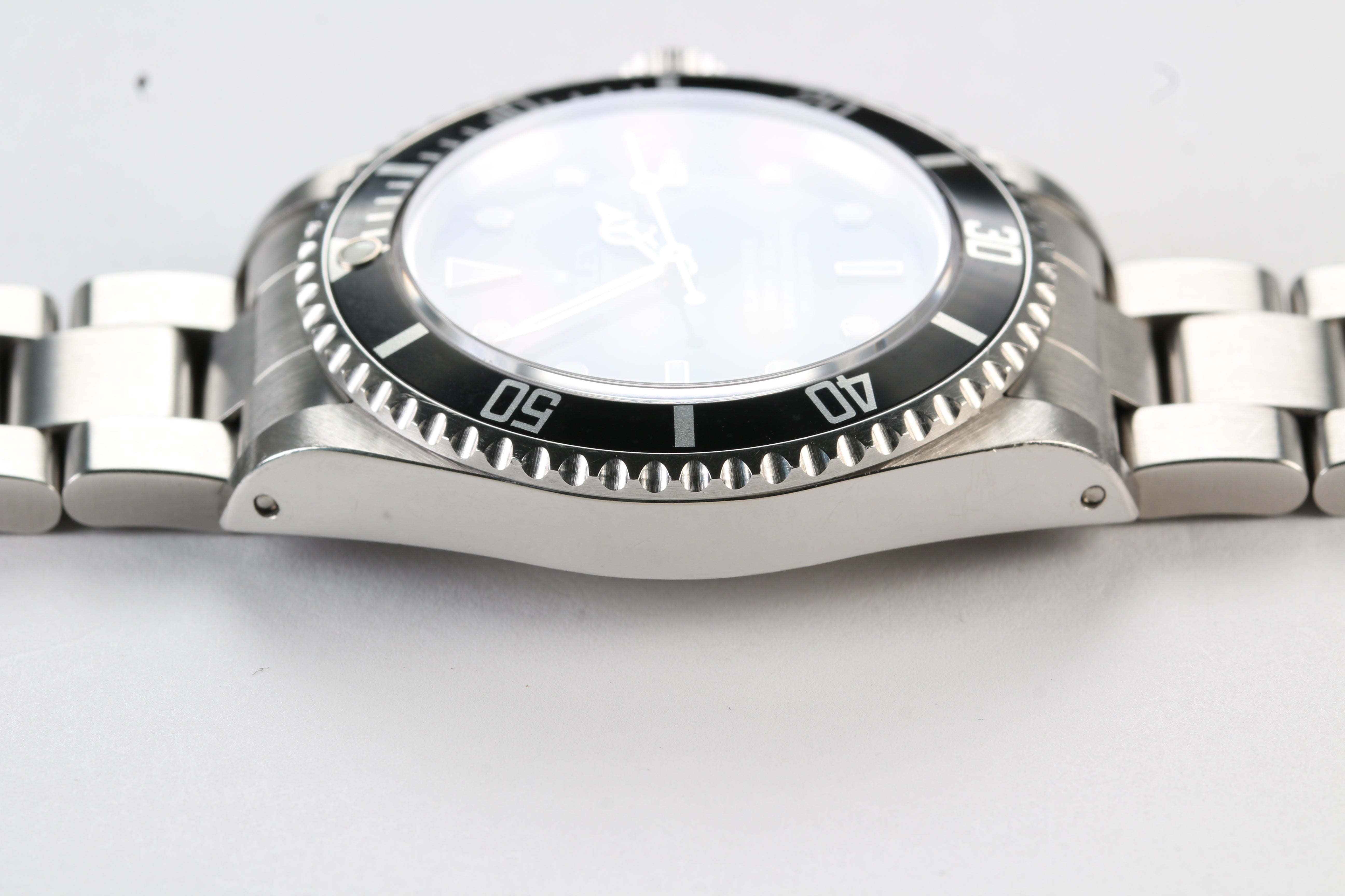 Rolex Submariner 14060M “Four Lines” on Oyster Bracelet with Warranty Card and Booklets