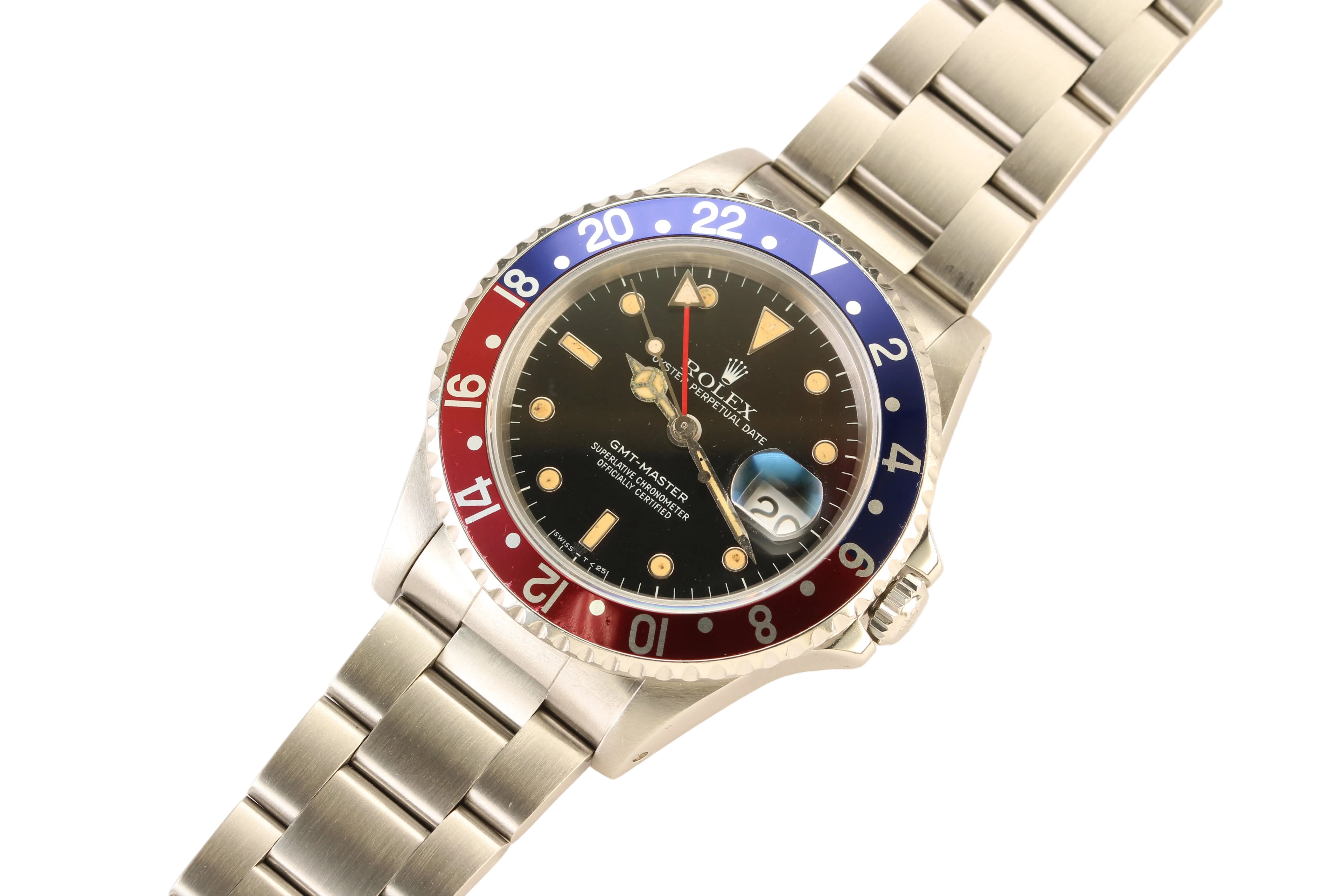 A Rolex GMT-Master wristwatch with a stainless steel Oyster bracelet and a distinctive red, blue, and black Pepsi bezel, shown on a clean white background.